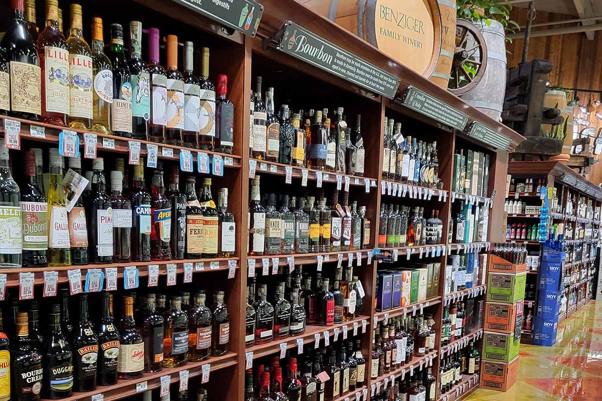 Shelves displaying key liquors at Nugget Market.