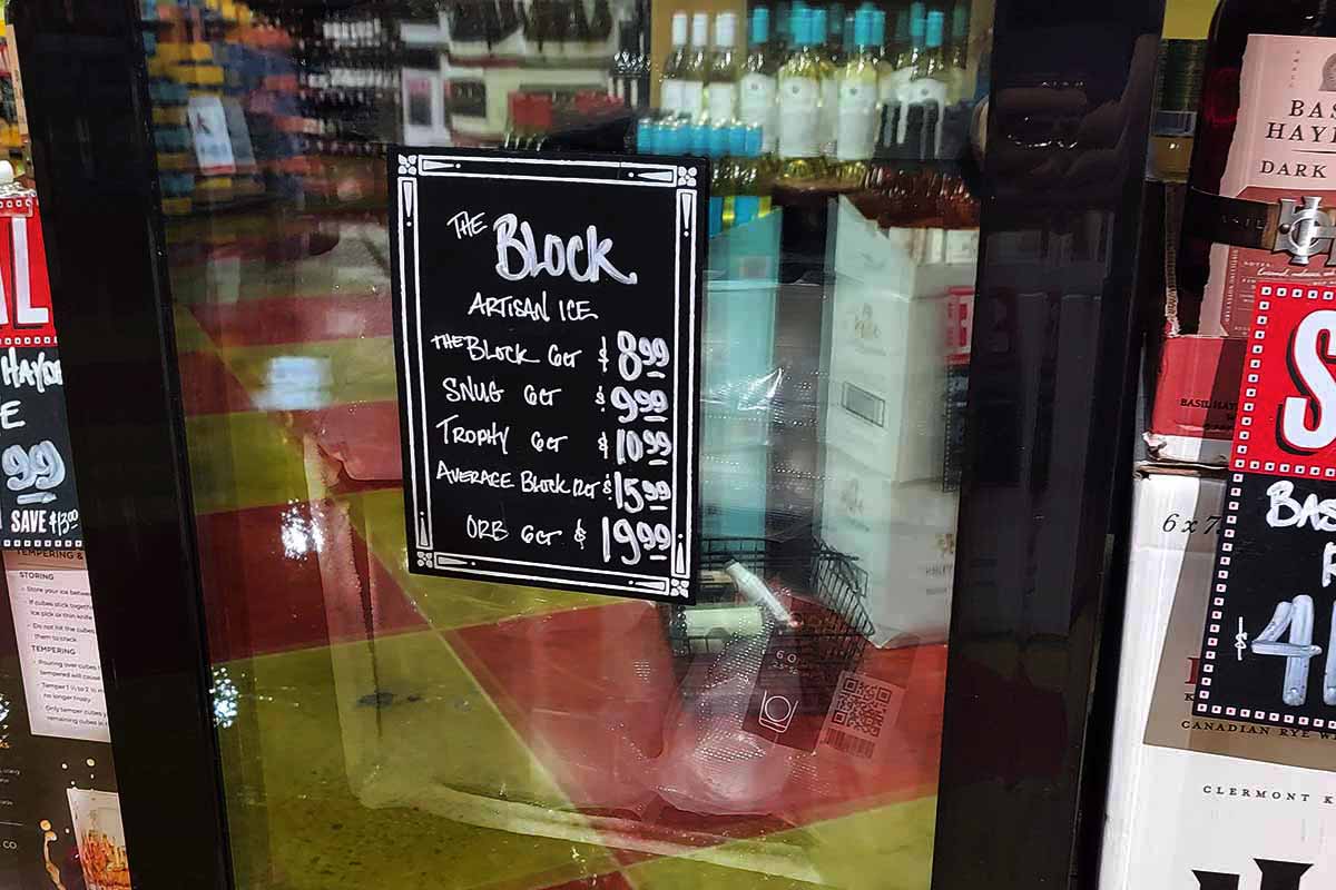 A refrigerator containing The Block Ice  for sale at Nugget Market.