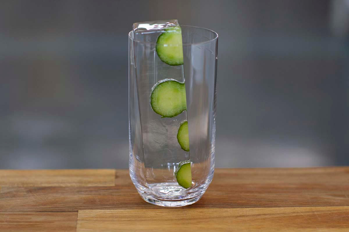 A Block Ice Collins Spear infused with slices of cucumber.
